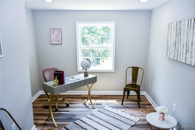 office space with hardwood / wood-style flooring