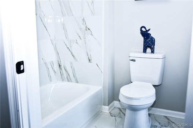 bathroom featuring a tub and toilet