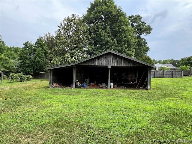 view of outbuilding featuring a lawn