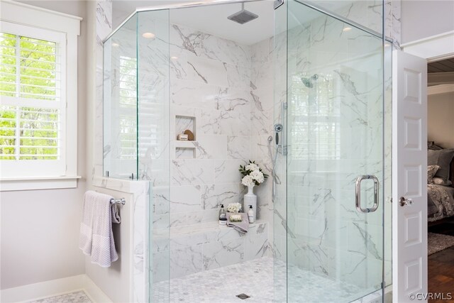 bathroom featuring an enclosed shower