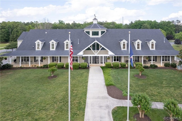 view of front of property with a front lawn and covered porch