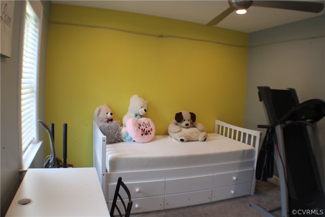 carpeted bedroom featuring ceiling fan