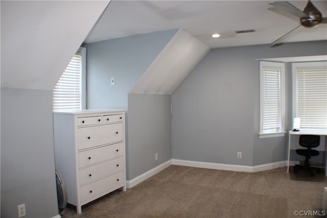 bonus room featuring light colored carpet, lofted ceiling, and ceiling fan