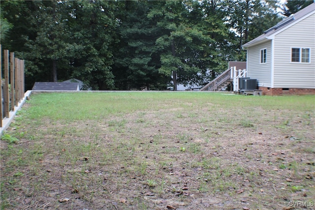 view of yard with central AC unit