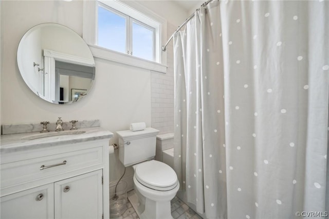 full bathroom featuring vanity, toilet, and shower / bathtub combination with curtain