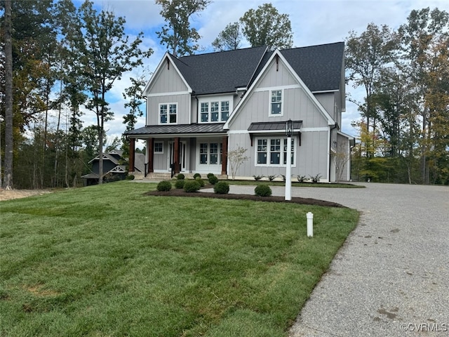 view of front facade with a front yard and a porch