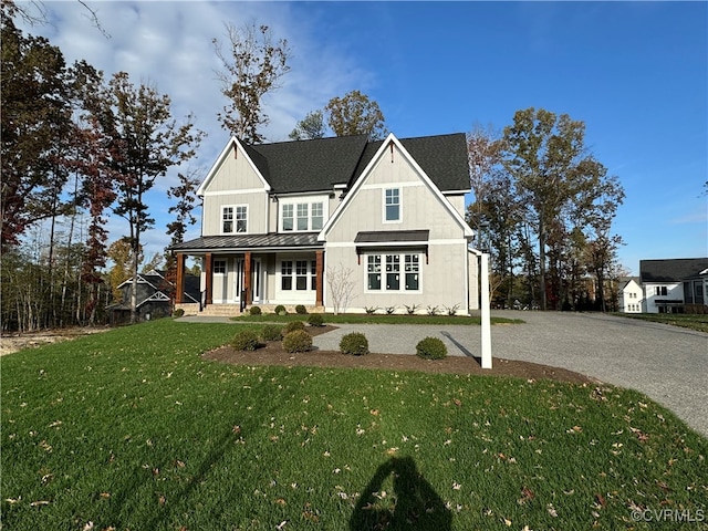 view of front of home with a front yard and a porch