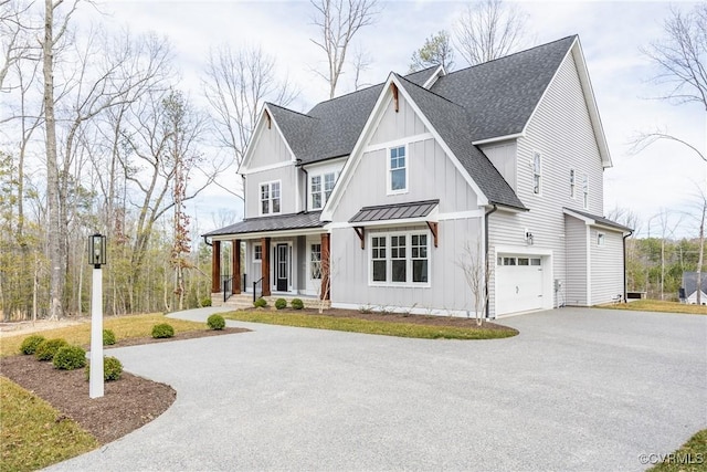 modern farmhouse style home with board and batten siding, a shingled roof, aphalt driveway, metal roof, and a standing seam roof