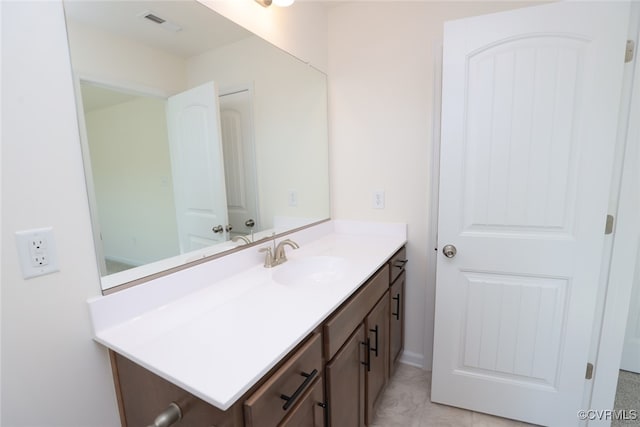 bathroom featuring vanity and tile patterned flooring