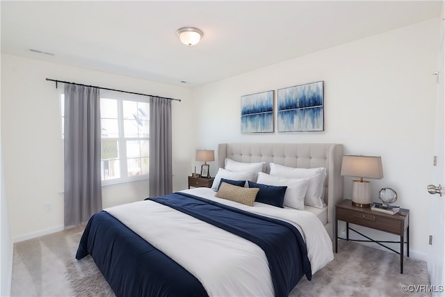 bedroom featuring light colored carpet