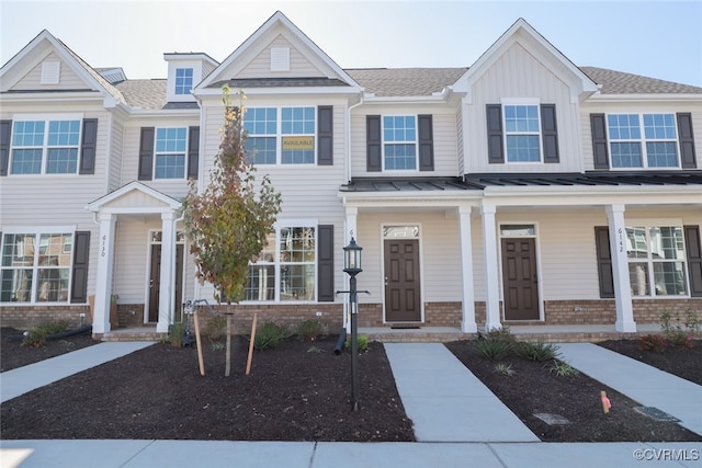 multi unit property featuring a porch