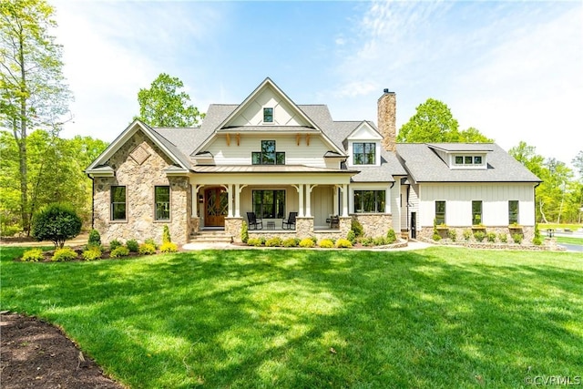 view of front of home featuring a front lawn and covered porch