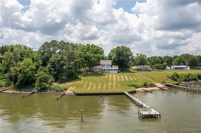 dock area featuring a water view and a lawn