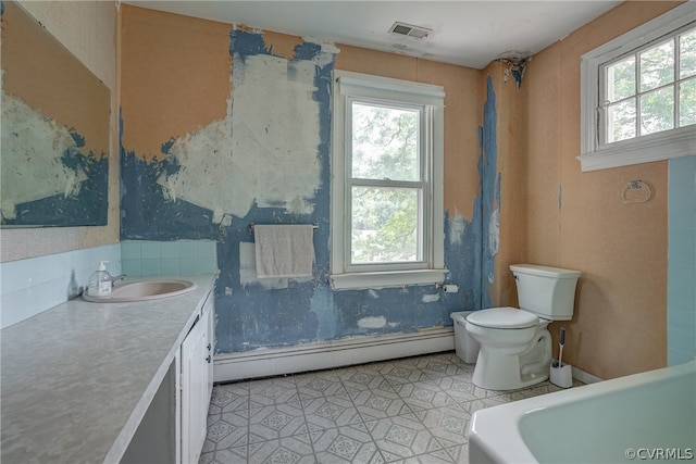 bathroom featuring a baseboard radiator, tile flooring, vanity, and toilet