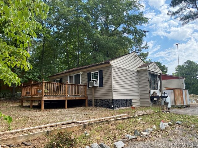 view of home's exterior featuring a deck