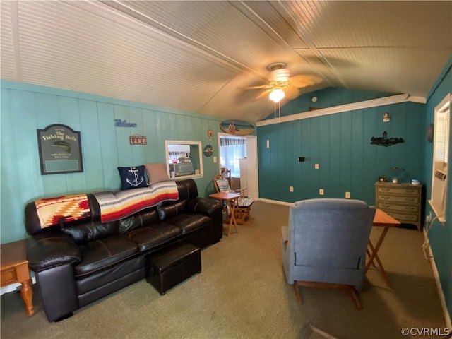 carpeted living room featuring ceiling fan and vaulted ceiling