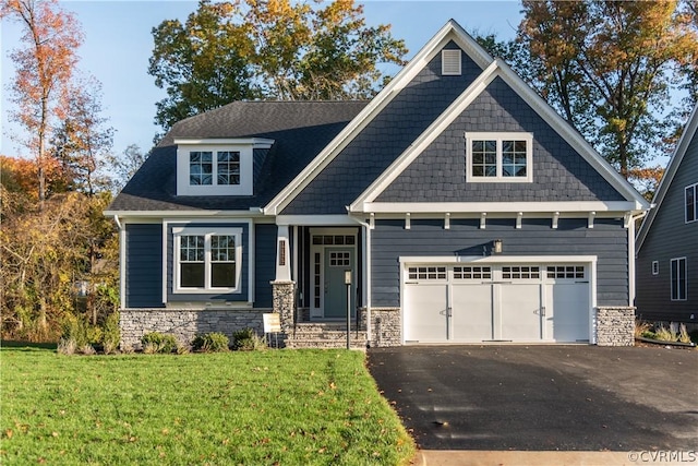 craftsman-style home with a front lawn and a garage