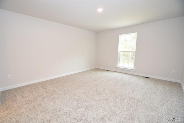 spare room featuring carpet flooring