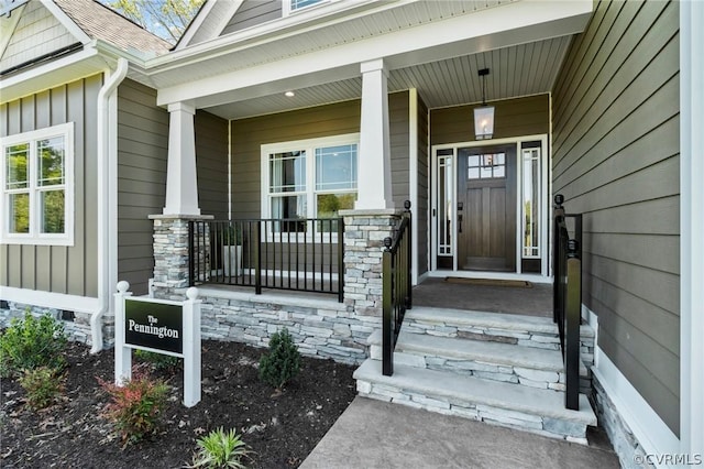 entrance to property with elevator and covered porch