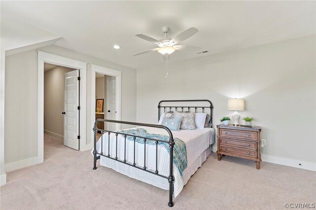 bedroom featuring ceiling fan and light colored carpet