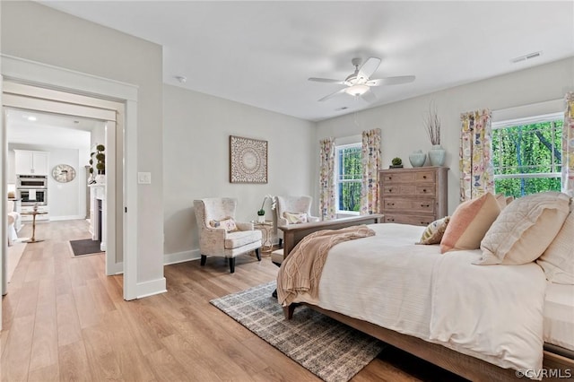 bedroom featuring light hardwood / wood-style flooring and ceiling fan