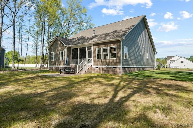 rear view of property featuring a yard and a patio area