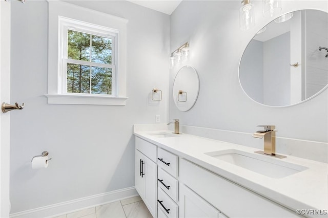 bathroom with tile patterned flooring and vanity