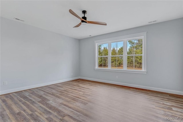 empty room featuring light hardwood / wood-style floors and ceiling fan