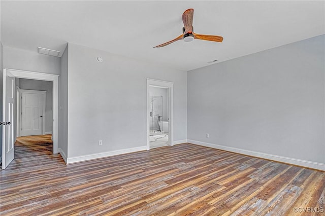 empty room featuring ceiling fan and dark hardwood / wood-style flooring