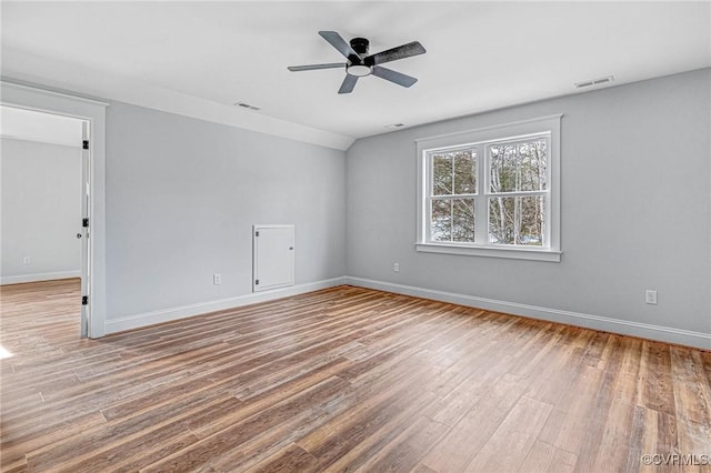 empty room featuring ceiling fan and hardwood / wood-style flooring