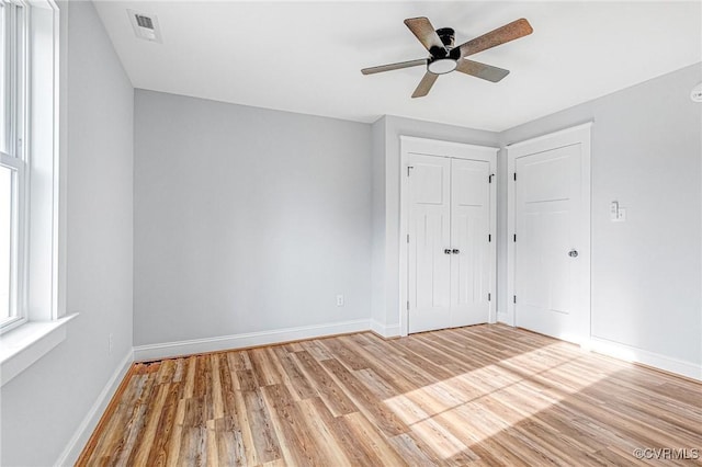 unfurnished bedroom with light hardwood / wood-style flooring and ceiling fan