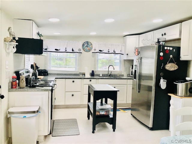 kitchen with white cabinets, sink, stainless steel fridge with ice dispenser, and exhaust hood