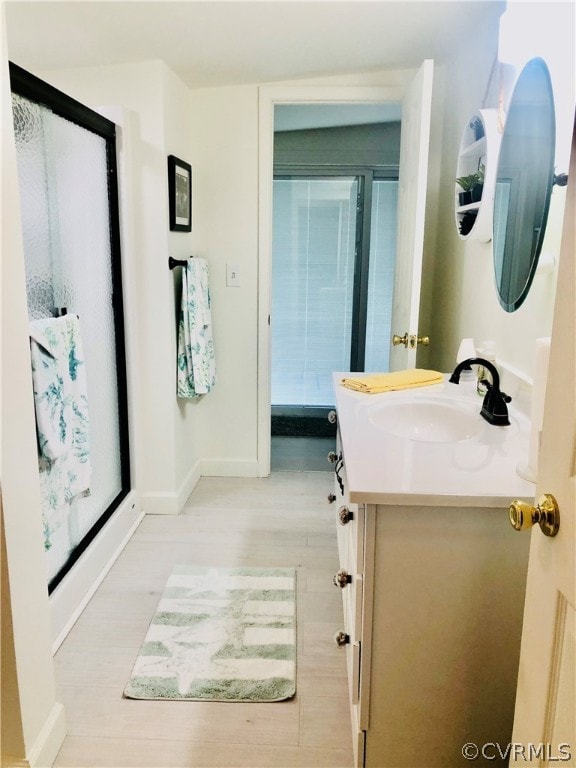 bathroom featuring vanity and hardwood / wood-style flooring