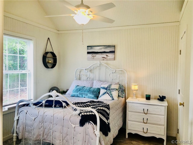 bedroom featuring ornamental molding, vaulted ceiling, and ceiling fan