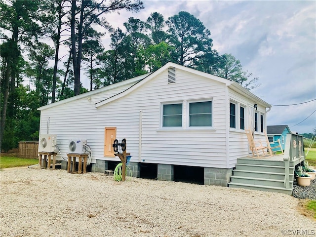 view of side of property with a wooden deck