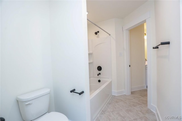 bathroom with tile patterned floors, toilet, and washtub / shower combination