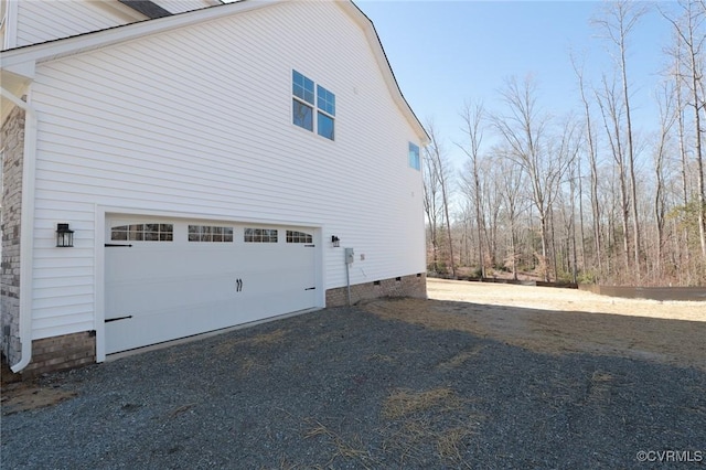 view of side of property with a garage