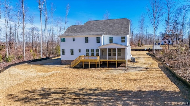 back of house with a sunroom, central AC, and a deck