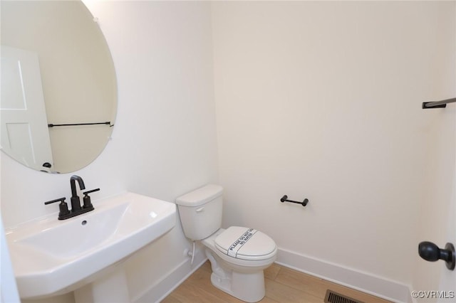 bathroom with sink and toilet