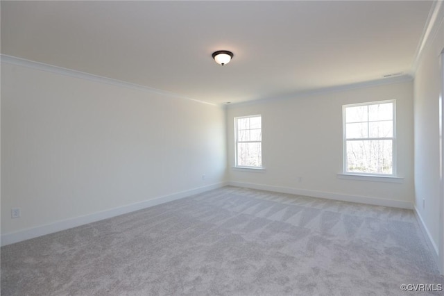 carpeted spare room with ornamental molding