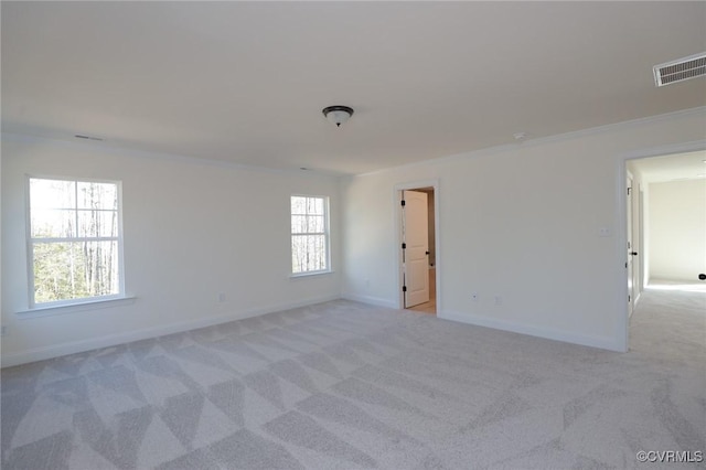 carpeted empty room with ornamental molding