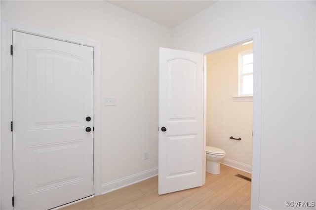 bathroom featuring toilet and hardwood / wood-style floors