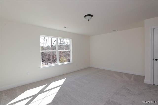 empty room featuring light colored carpet