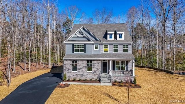 view of front of home featuring a porch and a front yard