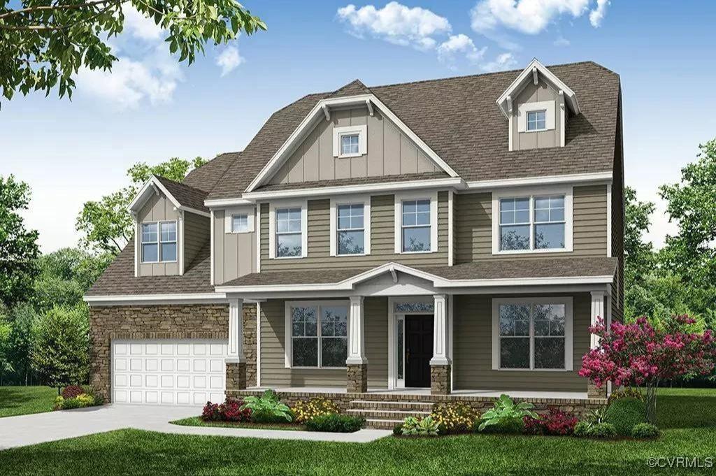 view of front of home featuring a garage and a front lawn