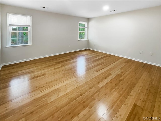 spare room with light wood-type flooring