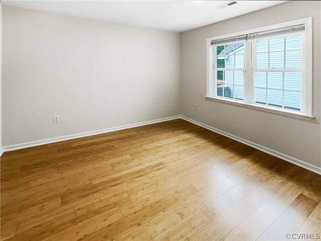 unfurnished room with light hardwood / wood-style flooring