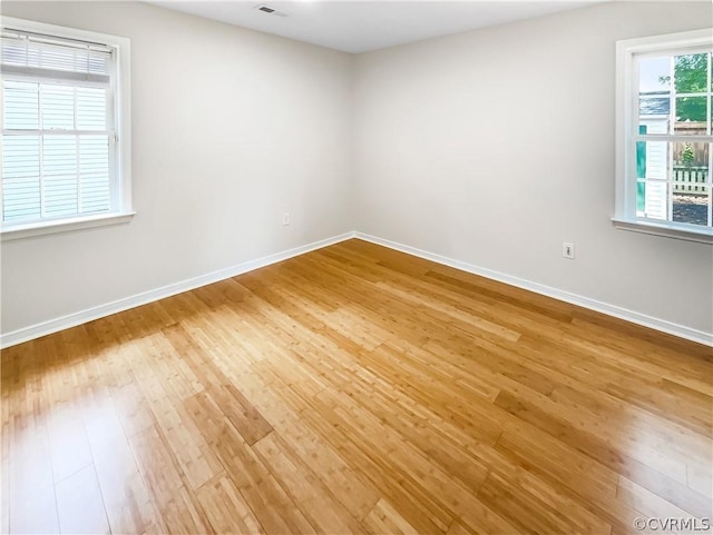 unfurnished room featuring wood-type flooring