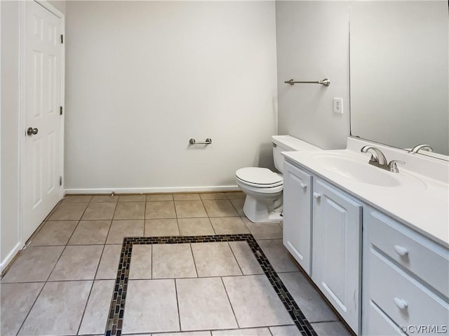 bathroom with tile patterned floors, vanity, and toilet