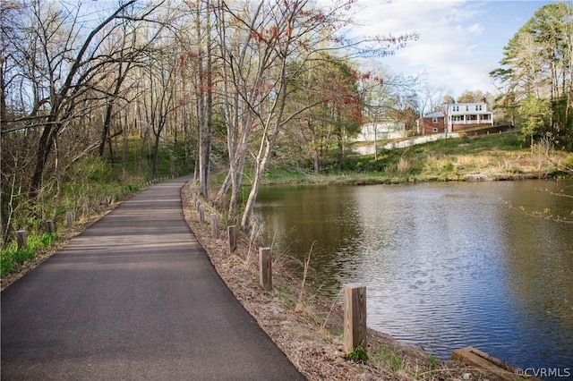 view of community with a water view